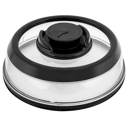 A clear vacuum food seal cover with a black lid, sitting on top of a salad inside a white bowl, illustrating the product's use.